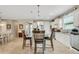 Spacious kitchen featuring granite countertops, stainless steel appliances, and an island with seating at 668 Cordoba Dr, Davenport, FL 33837