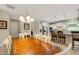 Charming dining area with a rustic wood table and white chairs at 668 Cordoba Dr, Davenport, FL 33837