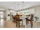 Bright kitchen boasts granite countertops, stainless steel appliances, and an island with seating at 668 Cordoba Dr, Davenport, FL 33837