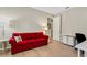 Home office with red couch and white desk and chair at 668 Cordoba Dr, Davenport, FL 33837