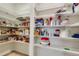 Large pantry with plenty of shelving for canned goods and dry storage at 668 Cordoba Dr, Davenport, FL 33837