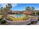 Resort-style community pool with palm trees and ample seating for residents at 668 Cordoba Dr, Davenport, FL 33837