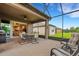Relaxing screened patio, outdoor furniture, view of backyard at 668 Cordoba Dr, Davenport, FL 33837