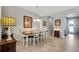 Spacious dining room with farmhouse table and chairs, near entryway at 668 Cordoba Dr, Davenport, FL 33837