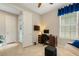 Bright home office features built-in desk, comfortable daybed and window seat at 668 Cordoba Dr, Davenport, FL 33837