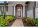 Inviting entryway with decorative door and stone accents at 668 Cordoba Dr, Davenport, FL 33837