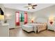 Main bedroom with king-size bed and en-suite bathroom access at 668 Cordoba Dr, Davenport, FL 33837