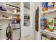 Walk-in pantry offers ample shelving for food storage and kitchen supplies at 668 Cordoba Dr, Davenport, FL 33837