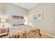 Cozy bedroom with a floral comforter and wood floors at 668 Cordoba Dr, Davenport, FL 33837