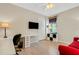 Home office with red couch and white desk and chair at 668 Cordoba Dr, Davenport, FL 33837
