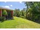 Landscaped backyard with lush greenery, providing a private oasis at 806 Ebb Tide Ln, Poinciana, FL 34759