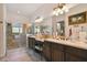 Spa-like bathroom with double vanity and walk-in shower at 806 Ebb Tide Ln, Poinciana, FL 34759