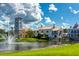 Community clubhouse with fountain and landscaping at 806 Ebb Tide Ln, Poinciana, FL 34759