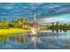 Serene fountain in a picturesque park-like setting with lush greenery at 806 Ebb Tide Ln, Poinciana, FL 34759