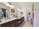 Bathroom with double vanity and walk-in shower at 806 Ebb Tide Ln, Poinciana, FL 34759
