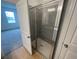 Shower with glass enclosure and ceramic tile at 5306 Maddie Dr, Haines City, FL 33844