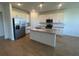 Modern kitchen with white cabinets and granite island at 5306 Maddie Dr, Haines City, FL 33844