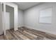 Bright bedroom with wood-look floors and ample closet space at 1419 36Th St, Orlando, FL 32839