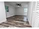 Spacious bedroom featuring wood-look floors and ceiling fan at 1419 36Th St, Orlando, FL 32839