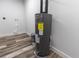 Laundry area with water heater and vinyl flooring at 1419 36Th St, Orlando, FL 32839