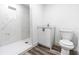 Modern bathroom with white marble shower and vanity at 1419 36Th St, Orlando, FL 32839