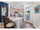 Modern kitchen with stainless steel appliances and breakfast bar at 3044 Salted Rim Rd, Kissimmee, FL 34747
