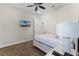 Cozy bedroom with a full-size bed and wall-mounted TV at 3044 Salted Rim Rd, Kissimmee, FL 34747