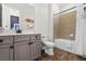 Bathroom with a bathtub, toilet, and double vanity at 3044 Salted Rim Rd, Kissimmee, FL 34747