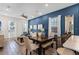 Open dining area with seating for four and wood dining table at 3044 Salted Rim Rd, Kissimmee, FL 34747