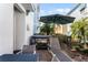 Relaxing patio with hot tub, lounge chairs, and umbrella at 3044 Salted Rim Rd, Kissimmee, FL 34747
