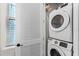 Convenient laundry room with stacked washer and dryer at 3044 Salted Rim Rd, Kissimmee, FL 34747