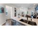 Modern kitchen with island, sink, and stainless steel dishwasher at 3044 Salted Rim Rd, Kissimmee, FL 34747