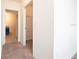 Hallway with carpet, linen closet and doors to bedrooms and bathroom at 1843 Brockridge Rd, Kissimmee, FL 34744