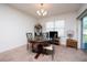 Bright dining room with round table and four chairs, overlooking backyard at 1843 Brockridge Rd, Kissimmee, FL 34744