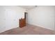 Simple bedroom with carpeted floors, neutral walls, and a dresser at 1843 Brockridge Rd, Kissimmee, FL 34744