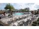 Community pool with lounge chairs and umbrellas at 1843 Brockridge Rd, Kissimmee, FL 34744