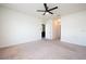 Spacious bedroom with ceiling fan and neutral-colored carpeting at 1843 Brockridge Rd, Kissimmee, FL 34744