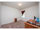 Small bedroom with carpeted floors, a window with blinds, and a small wooden dresser at 1843 Brockridge Rd, Kissimmee, FL 34744