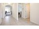 Bright and spacious entryway with tile floors and views into the living room and a hallway at 1843 Brockridge Rd, Kissimmee, FL 34744