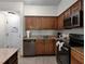Modern kitchen with granite countertops and stainless steel appliances at 12539 Floridays Resort Dr # 305-D, Orlando, FL 32821