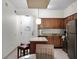Modern kitchen with granite countertops and stainless steel appliances at 12539 Floridays Resort Dr # 305-D, Orlando, FL 32821