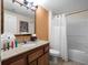 This bathroom boasts a shower/tub combo and granite countertop at 12539 Floridays Resort Dr # 305-D, Orlando, FL 32821