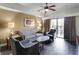 Comfortable living room featuring a sofa, armchairs, and a coffee table at 12539 Floridays Resort Dr # 305-D, Orlando, FL 32821