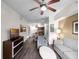 Bright living room with hardwood floors, flat-screen TV, and comfortable seating at 12539 Floridays Resort Dr # 305-D, Orlando, FL 32821