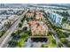 Aerial view of an apartment complex and lake at 12539 Floridays Resort Dr # 305-D, Orlando, FL 32821