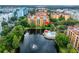 Aerial view of apartment building near lake and pool at 12539 Floridays Resort Dr # 305-D, Orlando, FL 32821