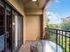 Private balcony with table and chairs, offering a relaxing outdoor space at 12539 Floridays Resort Dr # 305-D, Orlando, FL 32821