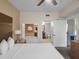 King-size bed with ensuite bathroom featuring a relaxing tub at 12539 Floridays Resort Dr # 305-D, Orlando, FL 32821