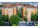 Aerial view of a building with several units and parking at 12539 Floridays Resort Dr # 305-D, Orlando, FL 32821
