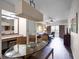 Glass dining table with seating for four in an open concept space at 12539 Floridays Resort Dr # 305-D, Orlando, FL 32821